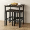 Compact dining set with two stools and table.